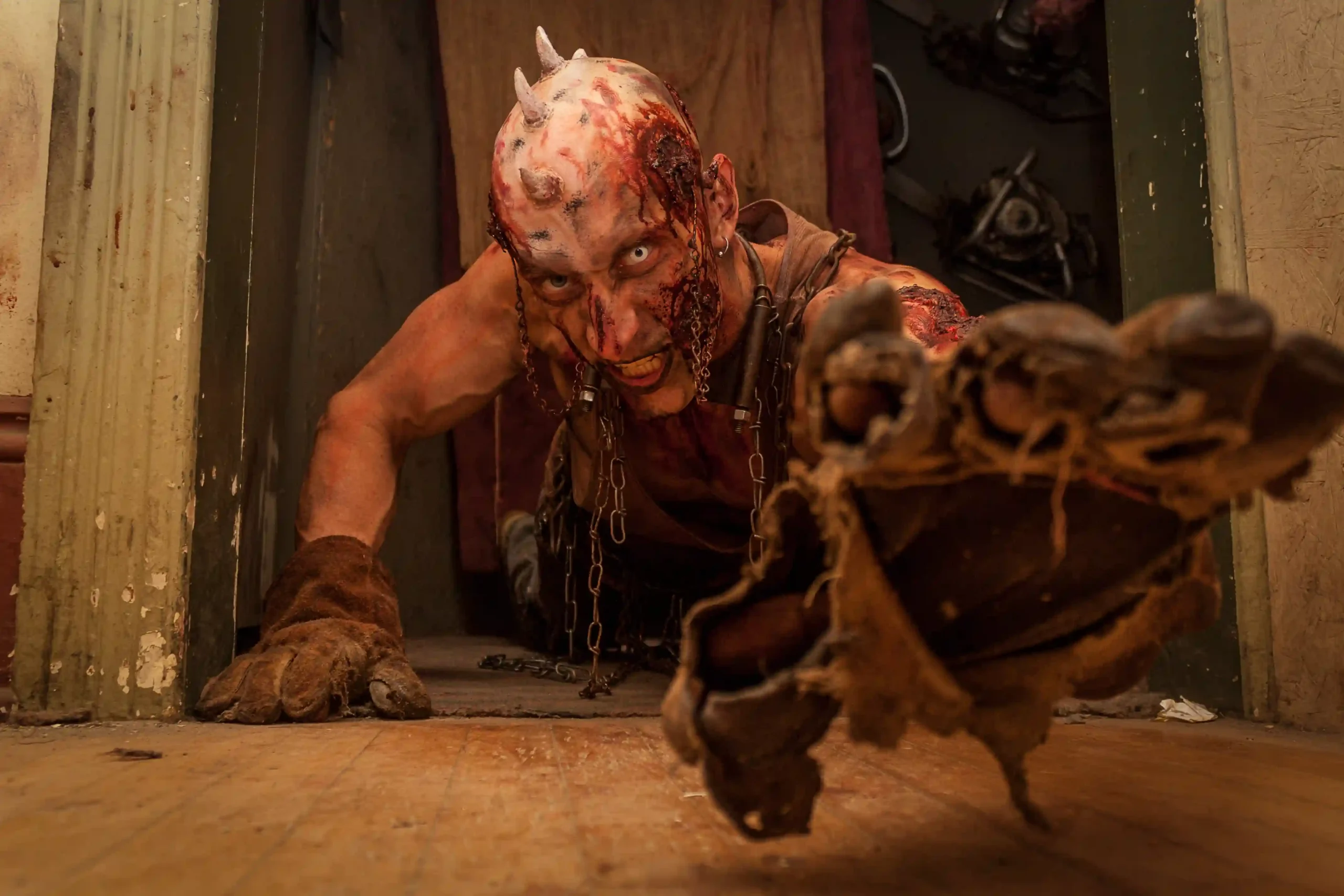 Hotel of Horror No. 13 Haunted House on BuzzFeed featuring a crawling horned ghoul reaching for guest
