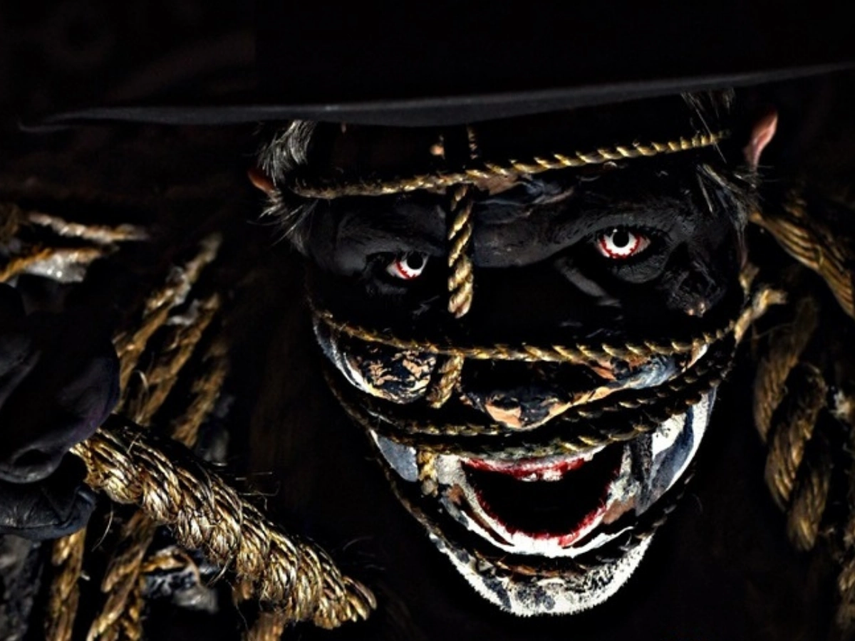 hotel-of-horror-scaryoverload-2025-must-see-1 Hotel of Horror ScaryOverload Must See Haunted House Featuring a Bound Ghoul emerging from the darkness