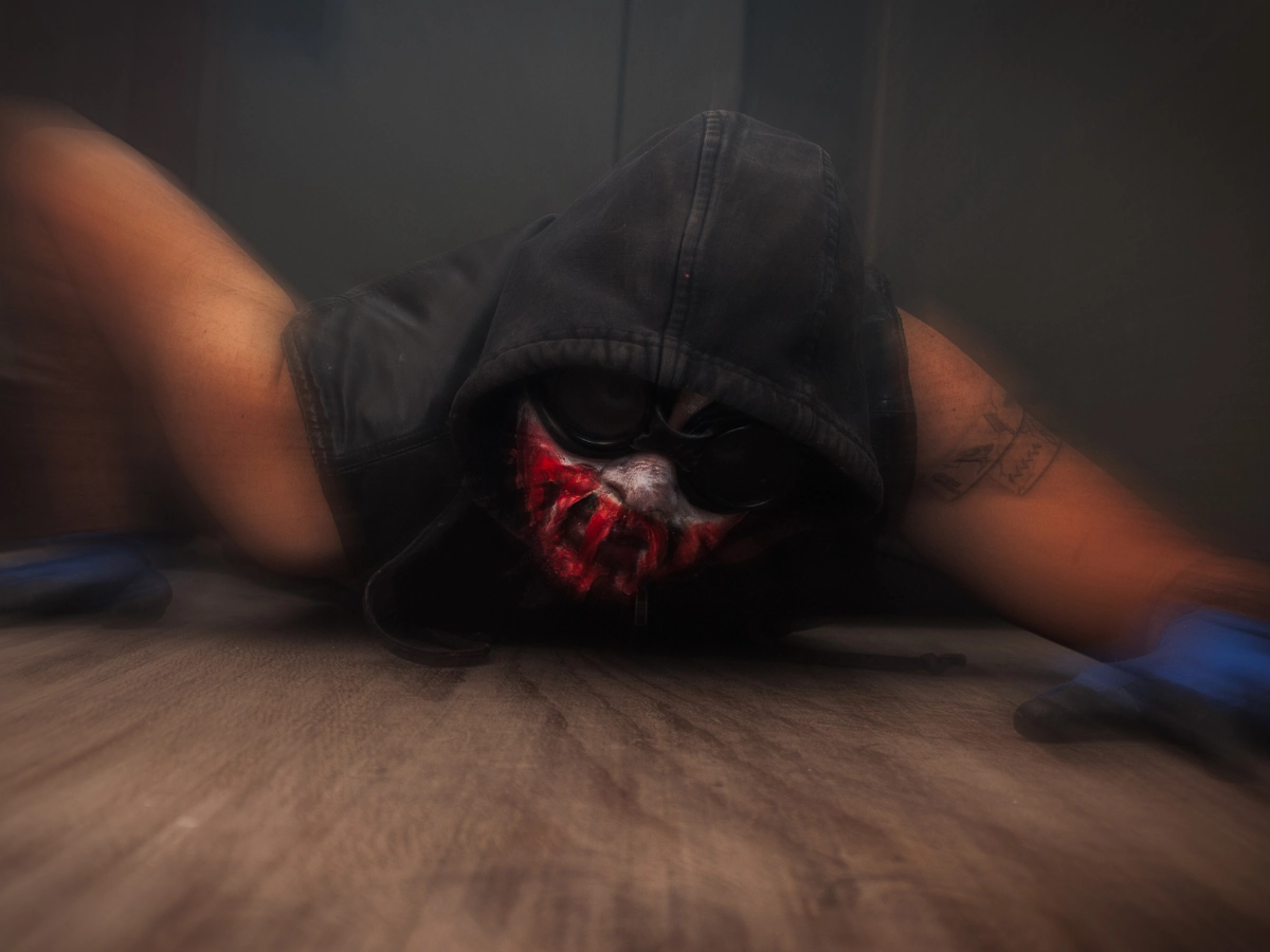 hotel-of-horror-scaryoverload-2025-must-see-2 ScaryOverload Must-See Haunted House featuring a crawling mouthless ghoul across an aging wood floor