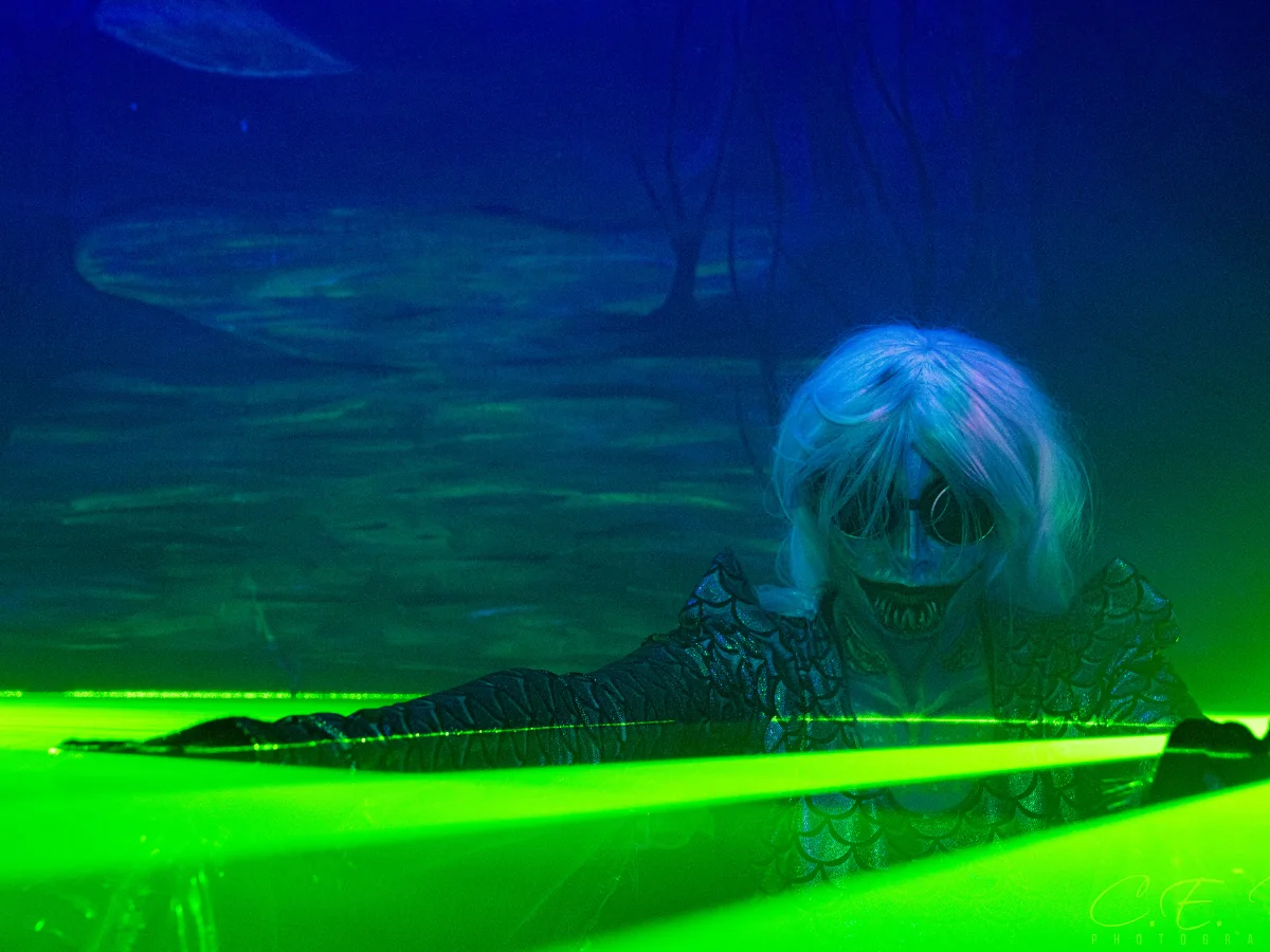 hotel-of-horror-scaryoverload-2025-must-see-3 Hotel of Horror Must-See Haunted House on ScaryOverload featuring a swamp siren emerging from the glowing abyss